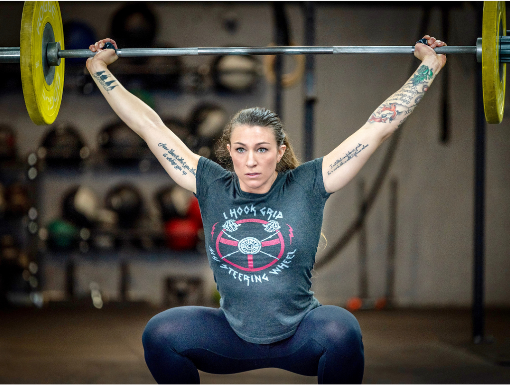 female athlete lifting weights