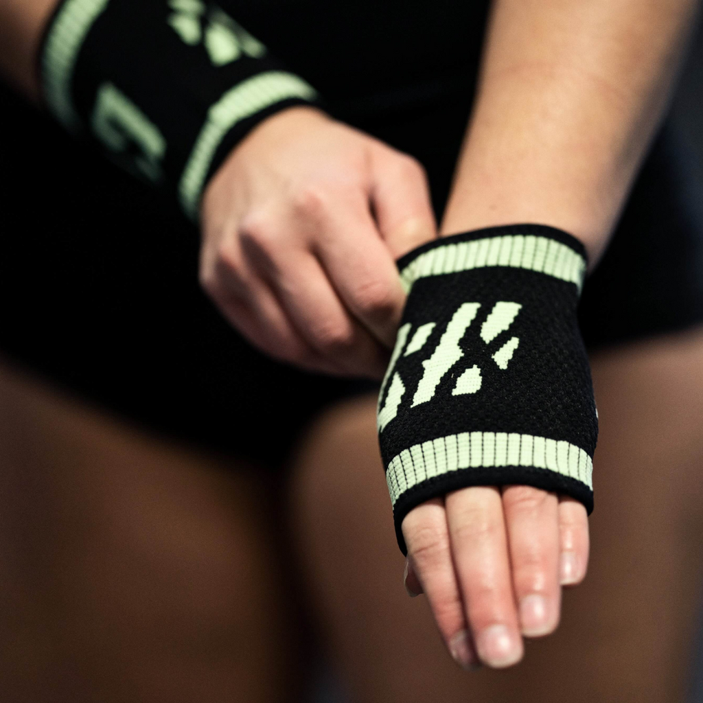 wrist shot female athlete wearing mint sweatband