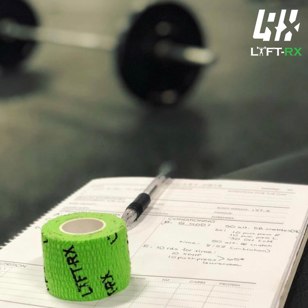 green lift rx tape on a wod gym notebook in crossfit gym